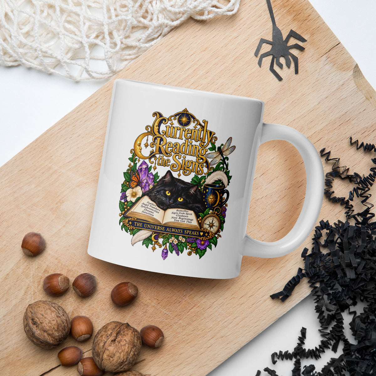 Currently Reading The Signs dark academia design, two black cats asleep over an open book beneath a crescent moon, on a white glossy mug, 20 oz, in a Halloween scene