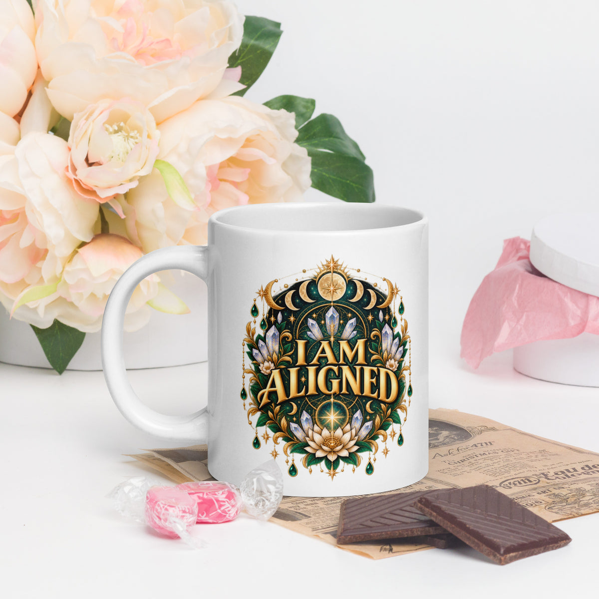I Am Aligned affirmation design with a lotus, quartz and moon phases in gold, on a white glossy mug, 20 oz, handle on the left