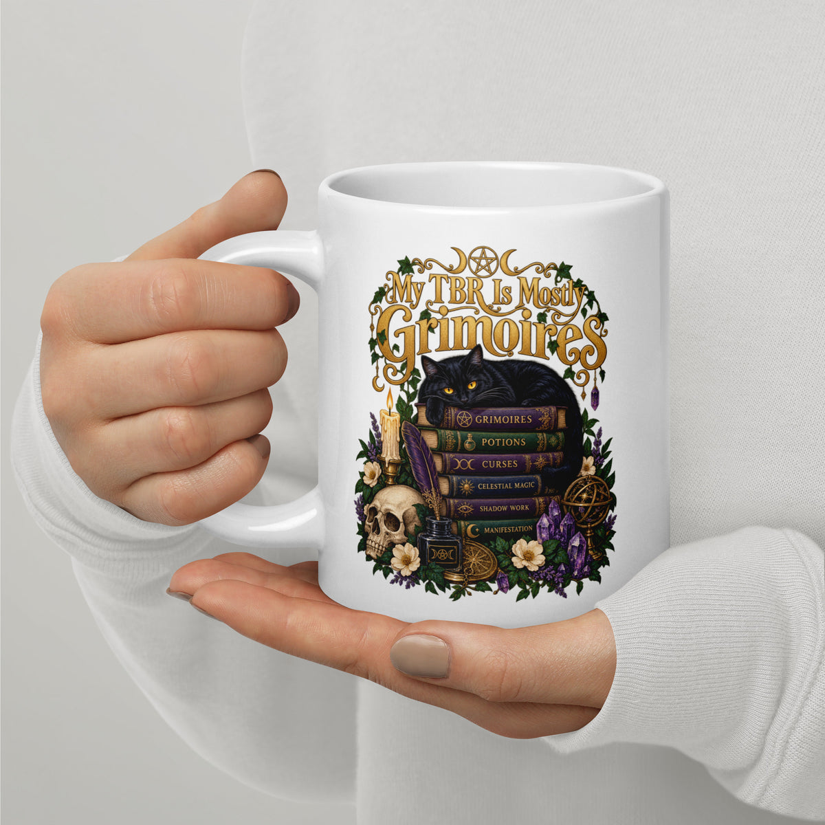 My TBR Is Mostly Grimoires dark academia design, a black cat guarding a stack of grimoires beside a skull, on a white glossy mug, 20 oz, handle on the left
