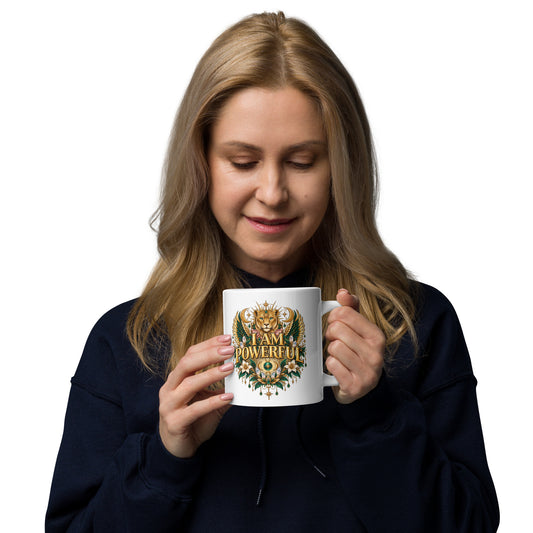 I Am Powerful affirmation design, a crowned winged lioness, on a white glossy mug, 20 oz, handle on the right