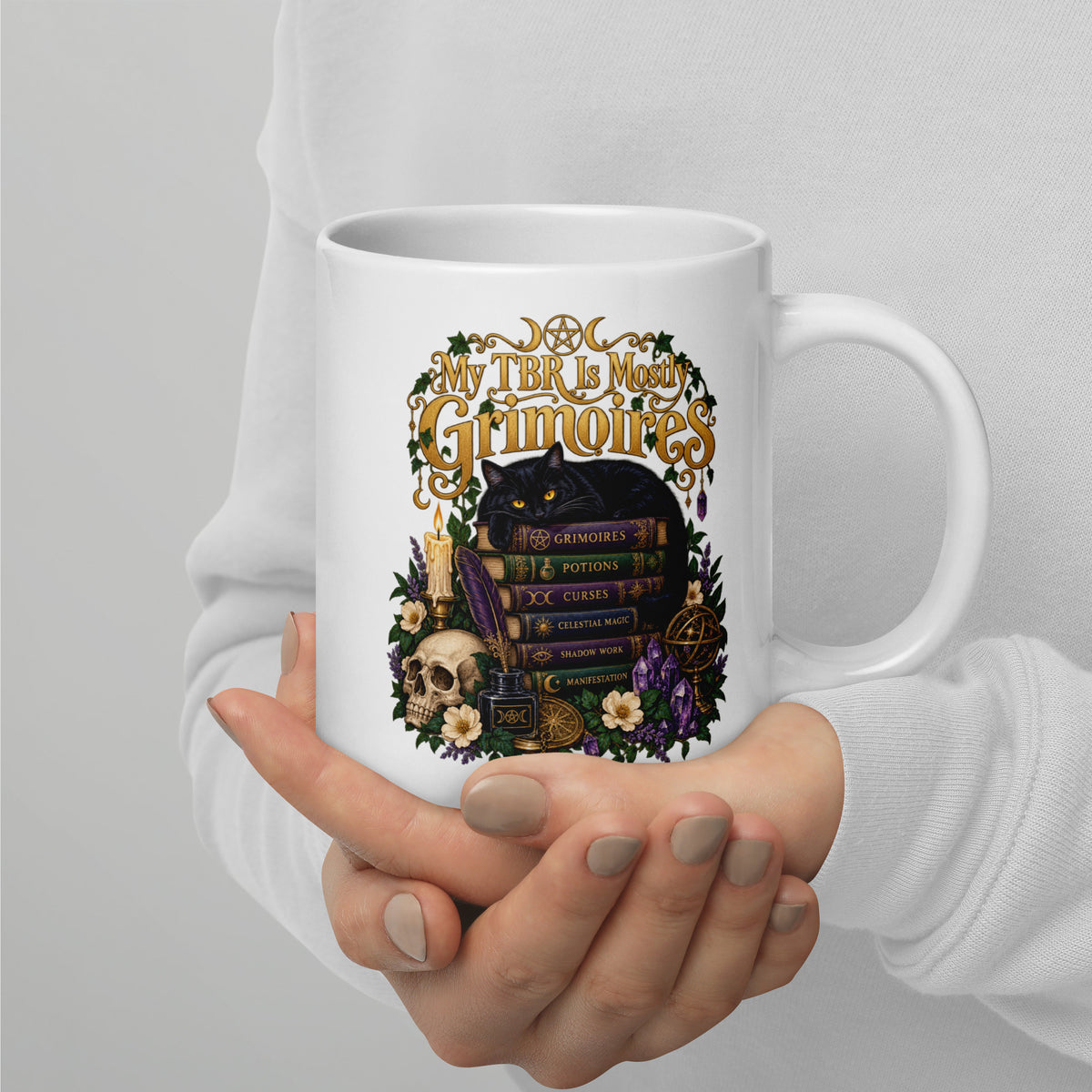 My TBR Is Mostly Grimoires dark academia design, a black cat guarding a stack of grimoires beside a skull, on a white glossy mug, 20 oz, handle on the right