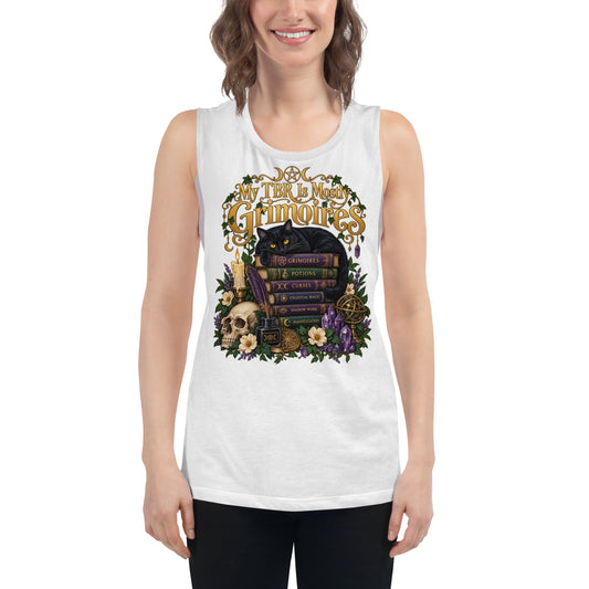 My TBR Is Mostly Grimoires dark academia design, a black cat guarding a stack of grimoires beside a skull, on a white ladies muscle tank, front view
