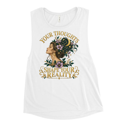 Your Thoughts Shape Your Reality ladies' muscle tank in white, front, laid flat. Gold lettering above a woman's profile with her thoughts becoming stars.