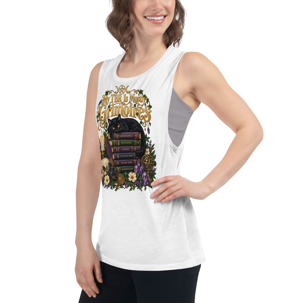 My TBR Is Mostly Grimoires dark academia design, a black cat guarding a stack of grimoires beside a skull, on a white ladies muscle tank, left front view