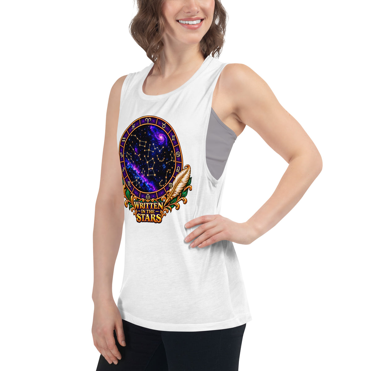 Written In The Stars astrology design, a zodiac wheel of constellations and a galaxy framed by gold scrollwork and a feather quill, on a white ladies muscle tank, left front view